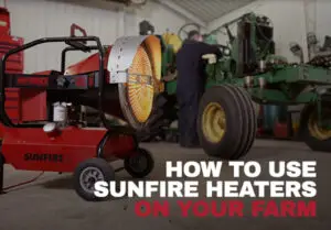 SunFire SF120 radiant heater showing how it is used in a pole barn on a farm to warm a farmer working on a tractor.