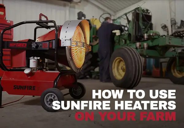 SunFire SF120 radiant heater showing how it is used in a pole barn on a farm to warm a farmer working on a tractor.